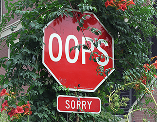 A stop sign edited to read “Oops, Sorry”